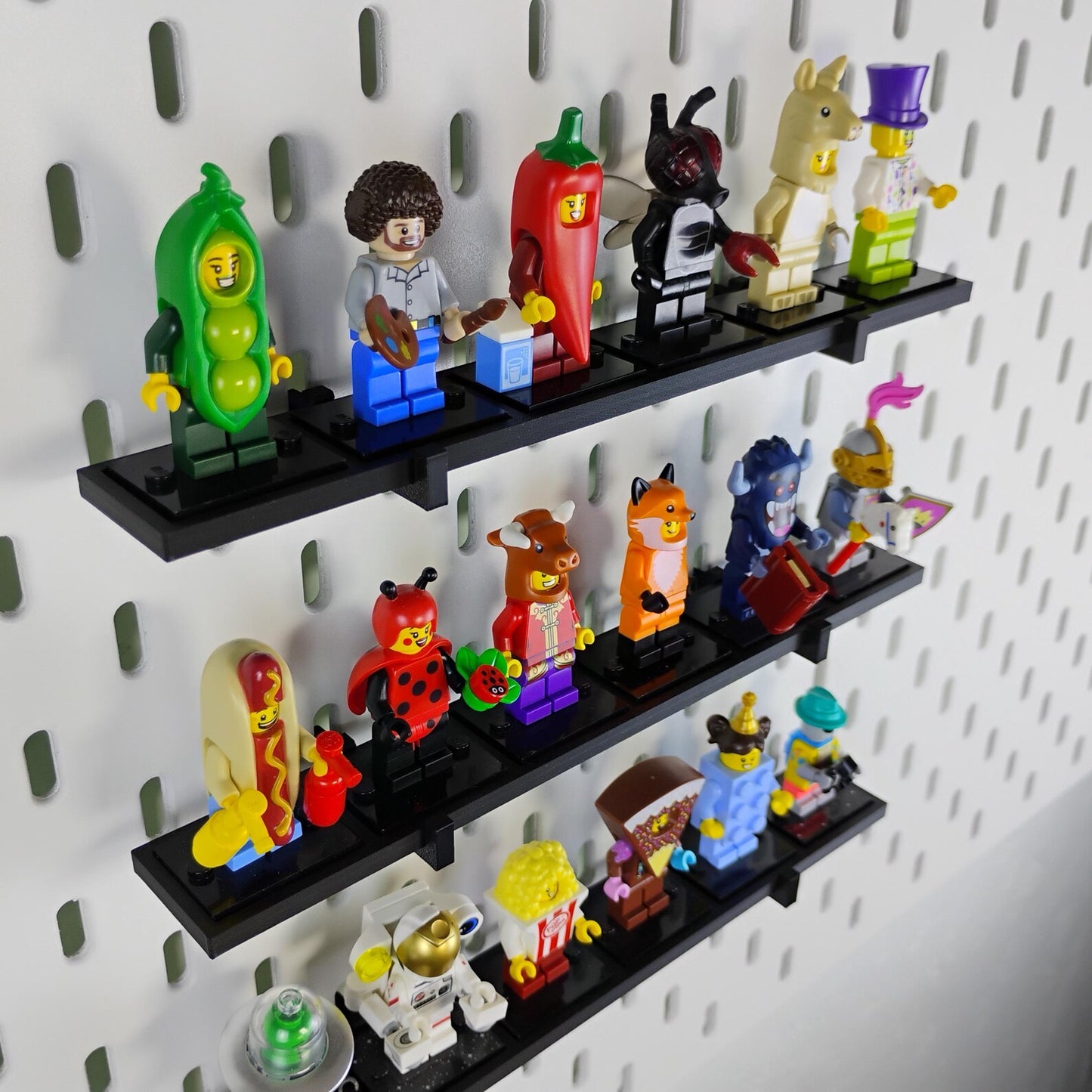 SKADIS compatible minifigure display shelves holding LEGO® minifigures on an IKEA pegboard