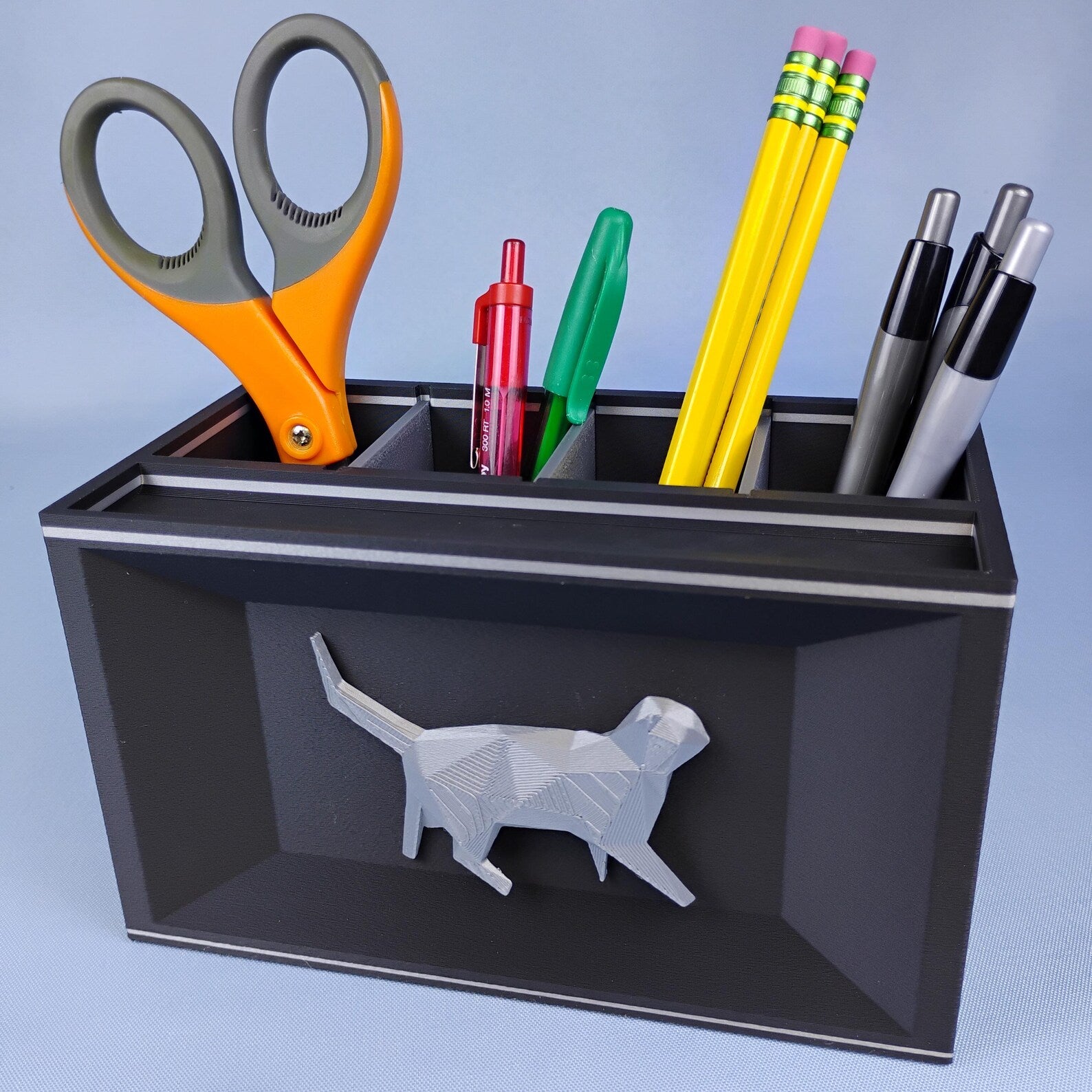 Black Cat desk caddy with removable dividers holding pens, pencils, and scissors