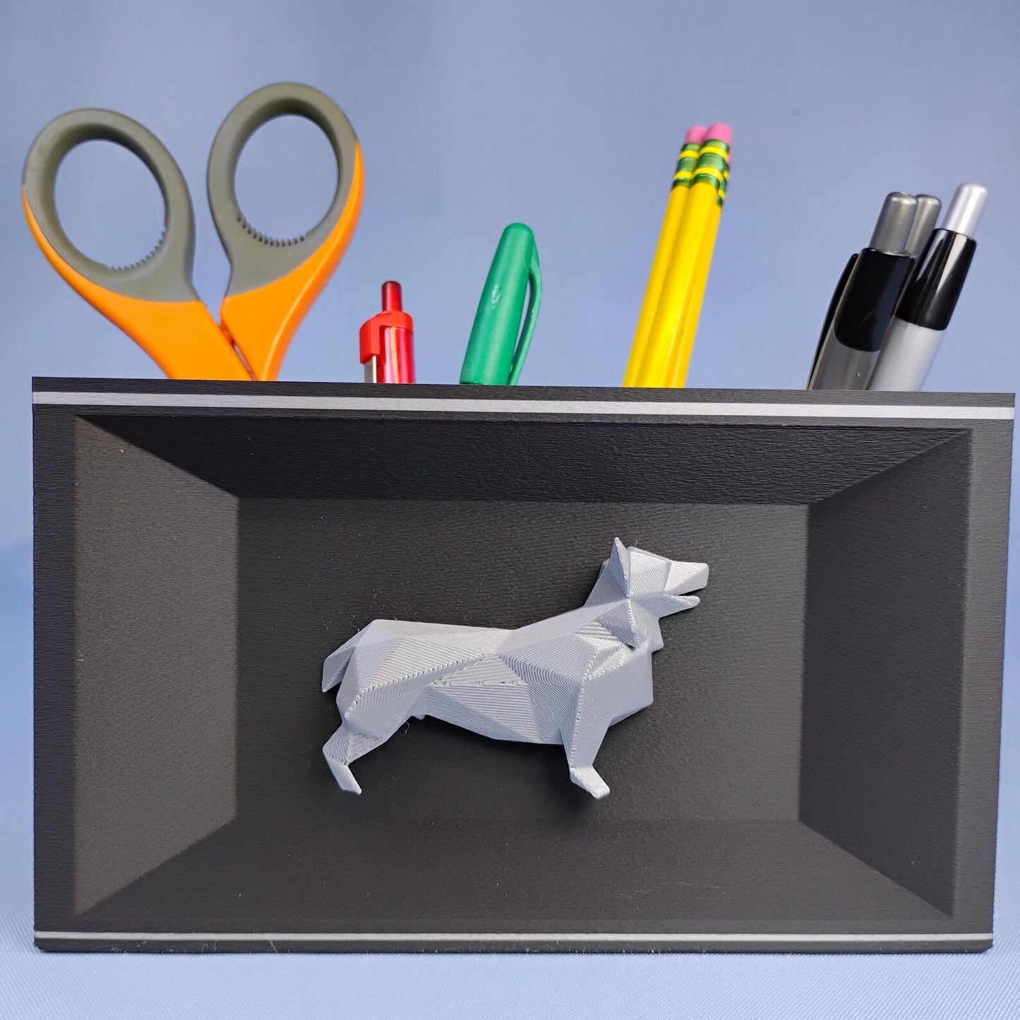 Black Corgi desk organizer with raised geometric dog detail shown from the front