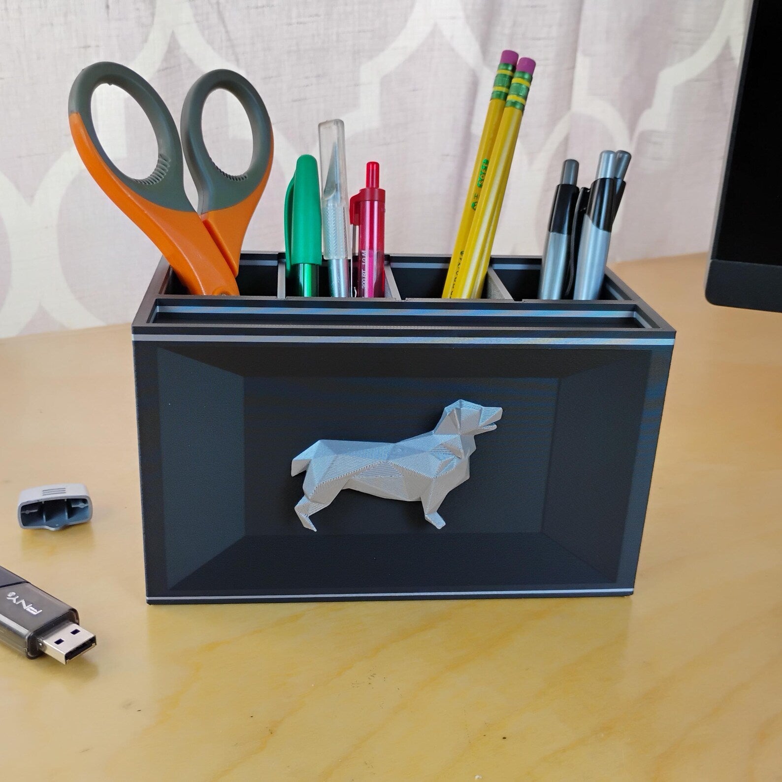 Black Corgi office organizer holding scissors, pencils, pens, and small desk supplies