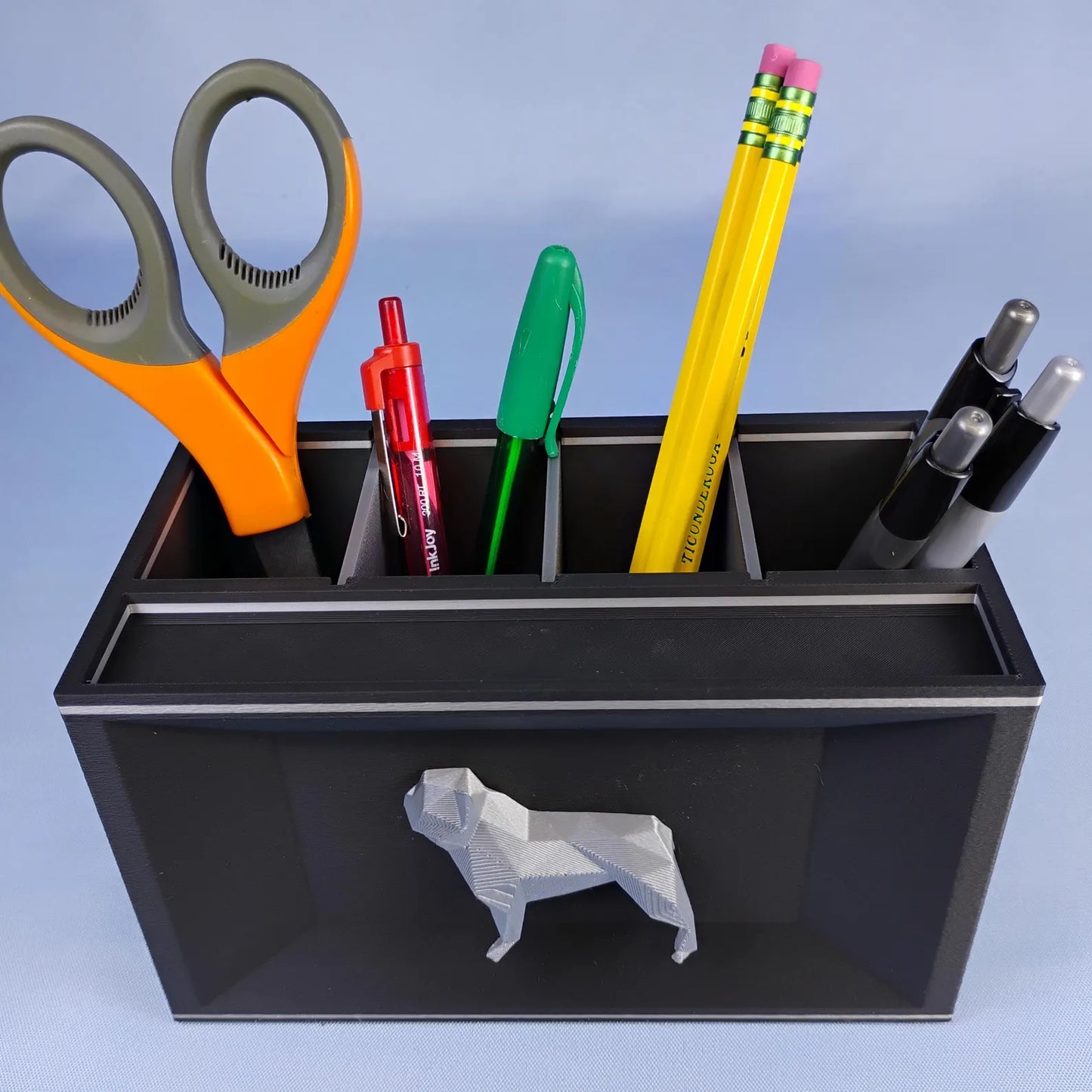 Black French Bulldog desk caddy with removable dividers holding pens, pencils, and scissors