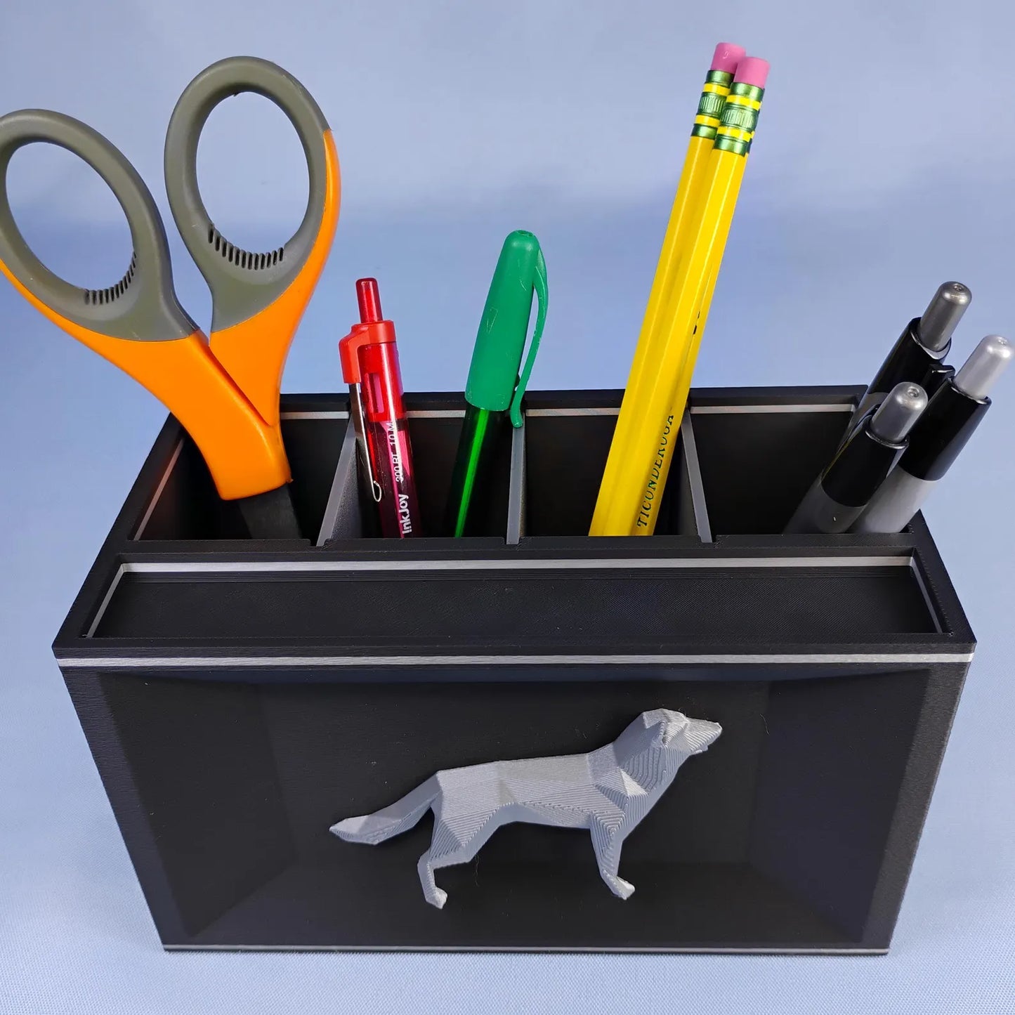 Black German Shepherd desk caddy with removable dividers holding pens, pencils, and scissors