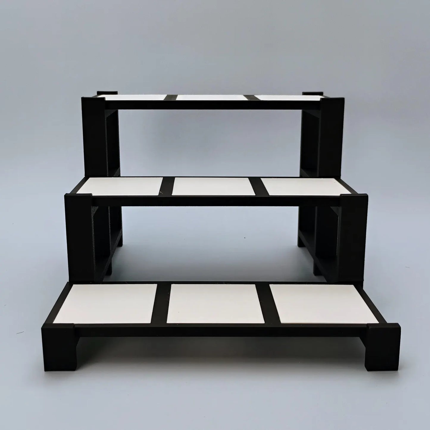 Empty black and white tiered display stand for Funko Pops, collectibles, trinkets, and shelf decor.