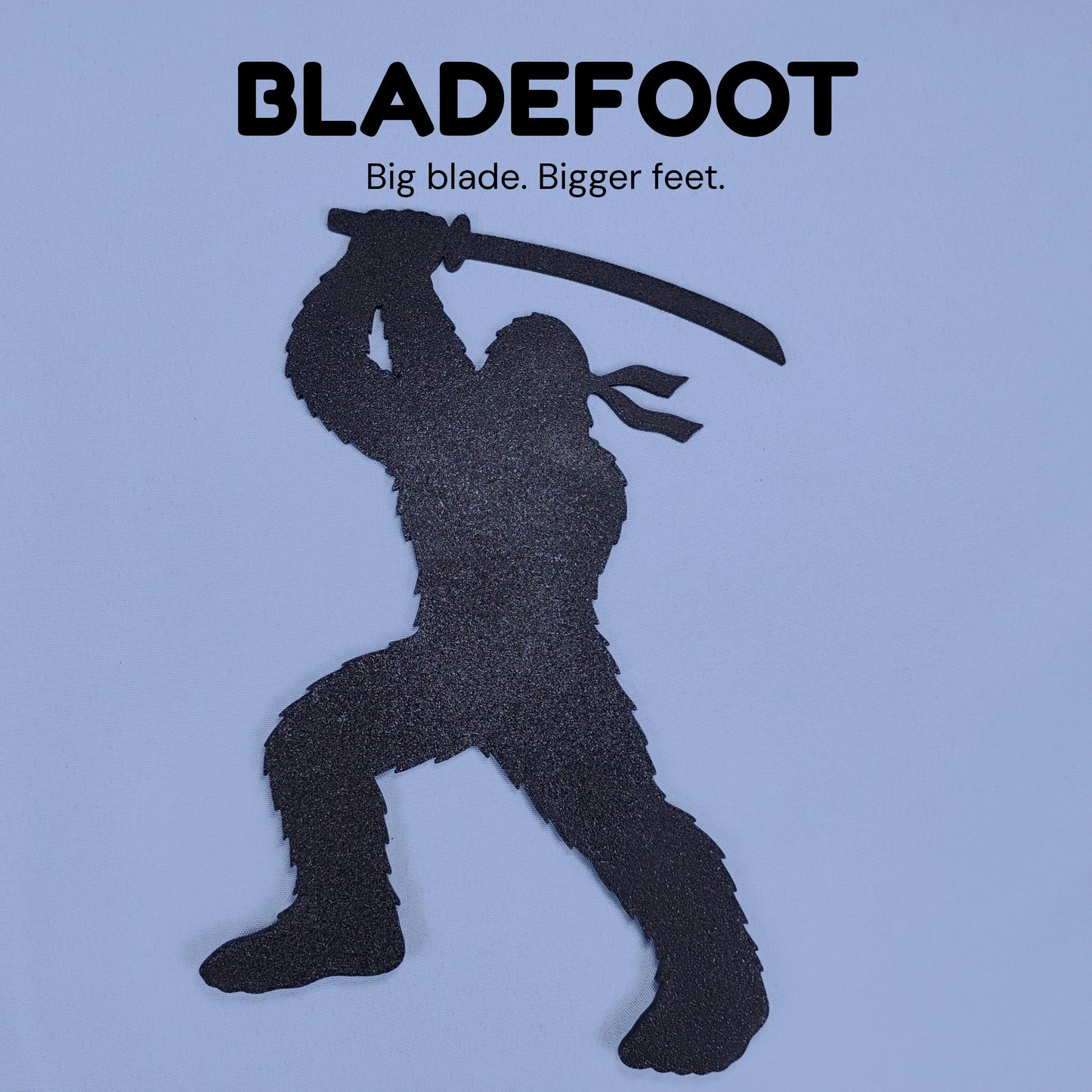 Bladefoot Ninja Bigfoot silhouette holding an oversized sword with the caption Big blade, bigger feet.