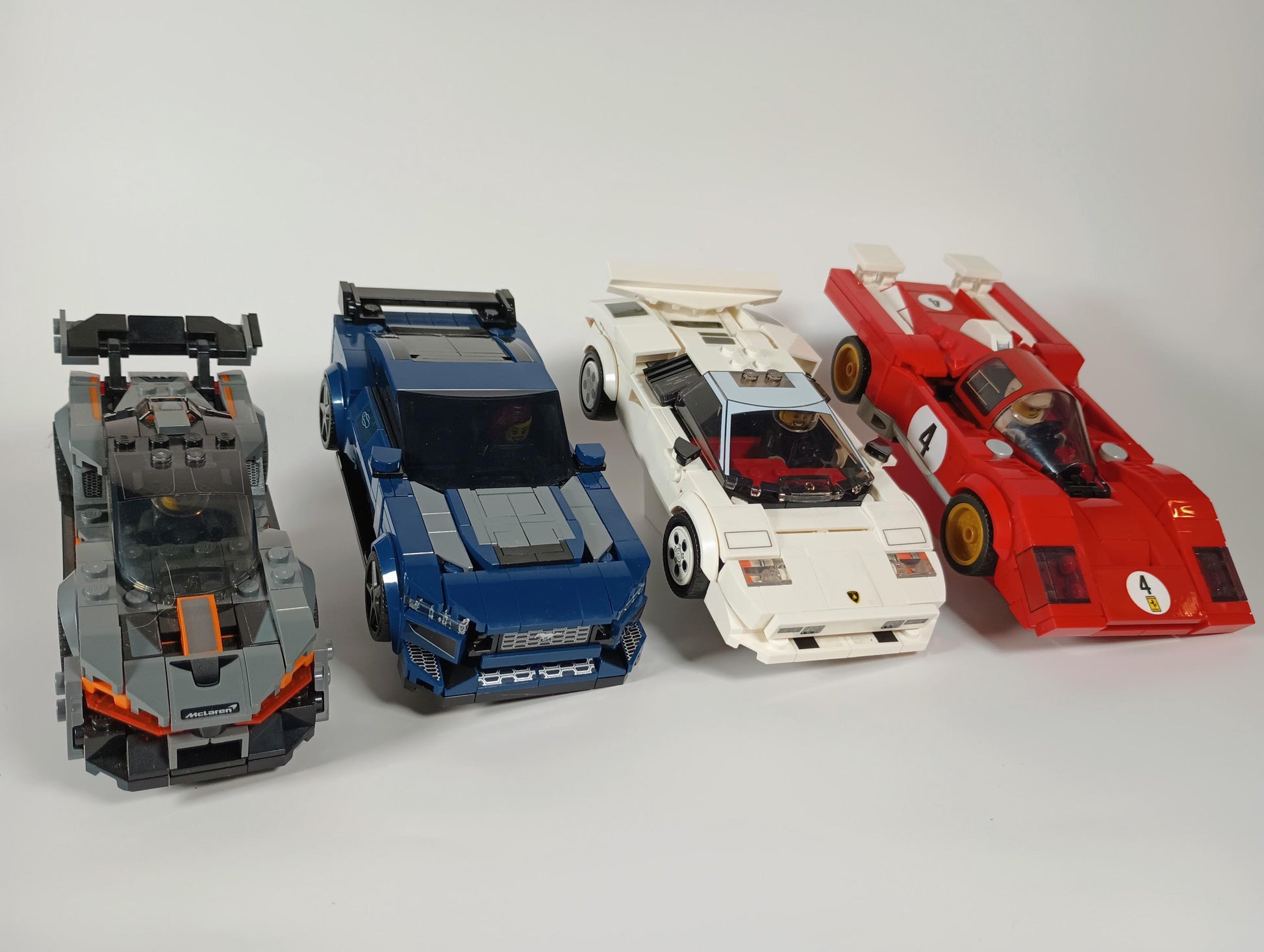 Brick-built cars displayed on low profile stands for LEGO® vehicle collections