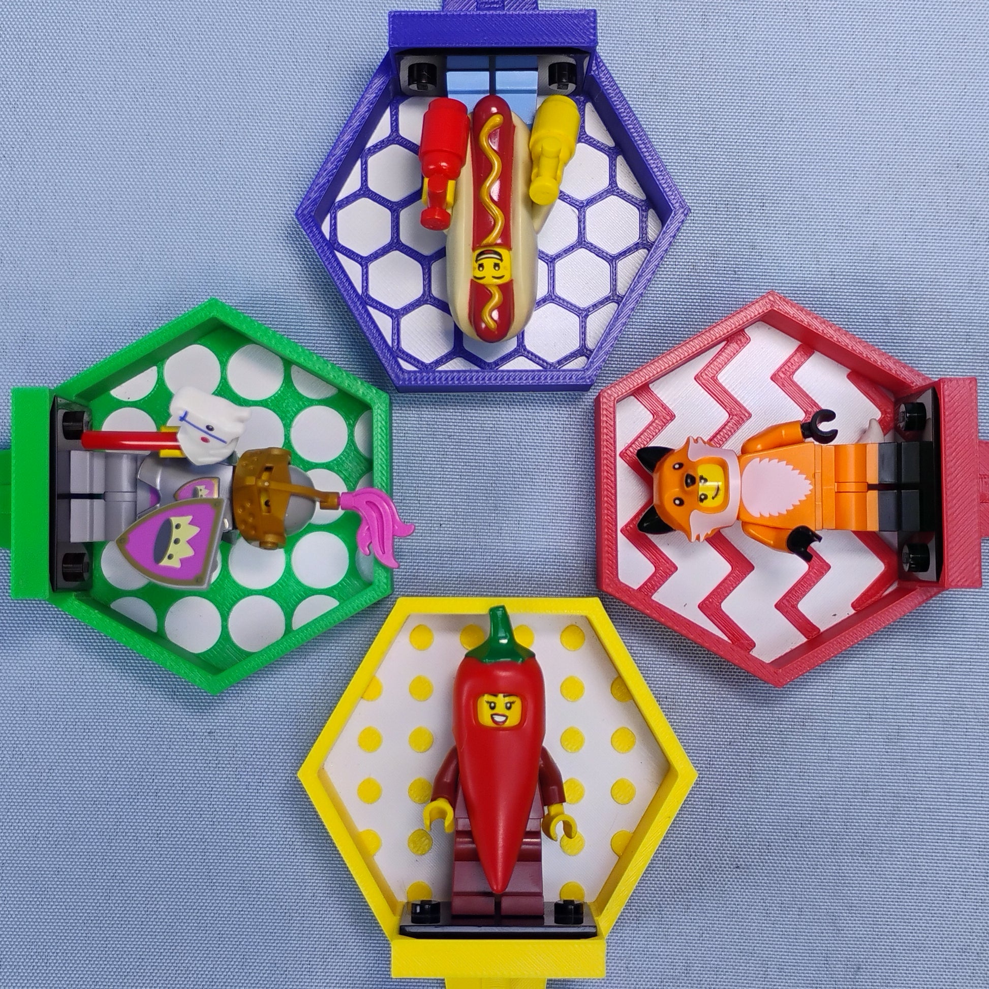 Mixed-color LEGO® minifigure plant stake displays with assorted minifigures and hexagon, circle, studs and zigzag backgrounds.