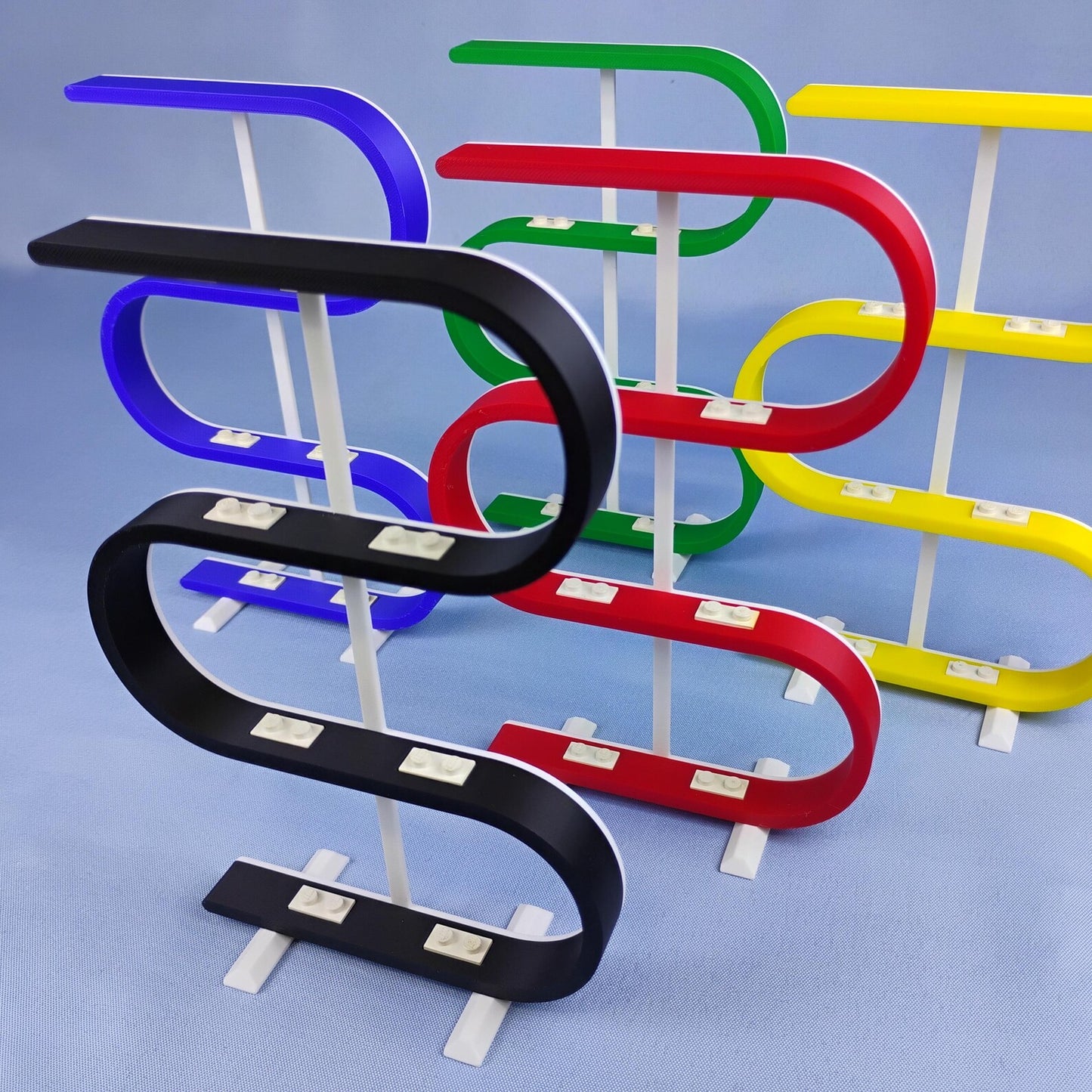 Red, blue, green, yellow, and black squiggle stands for displaying LEGO® minifigures