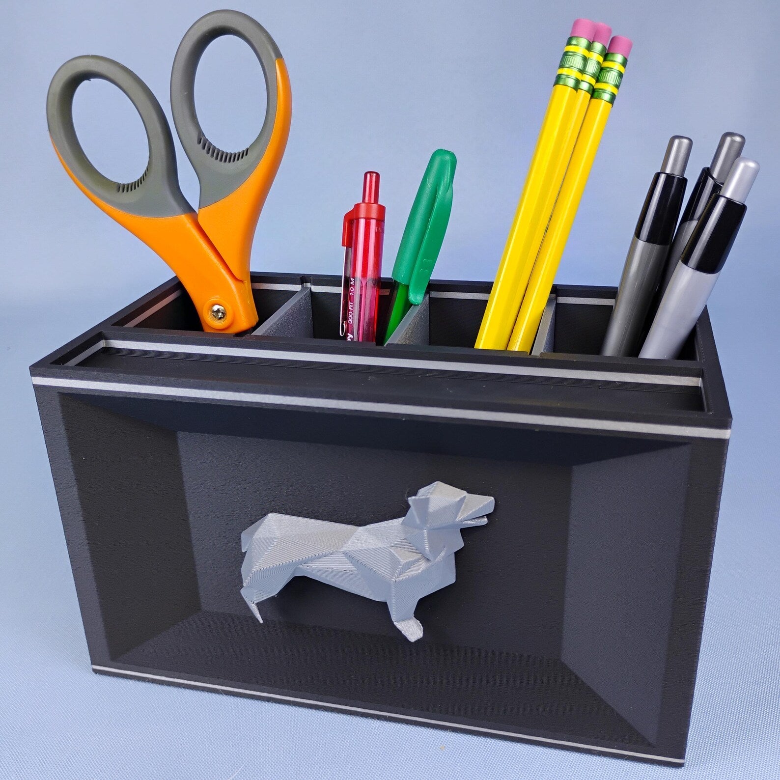 Black Corgi desk organizer holding scissors, pencils, pens, and small office tools