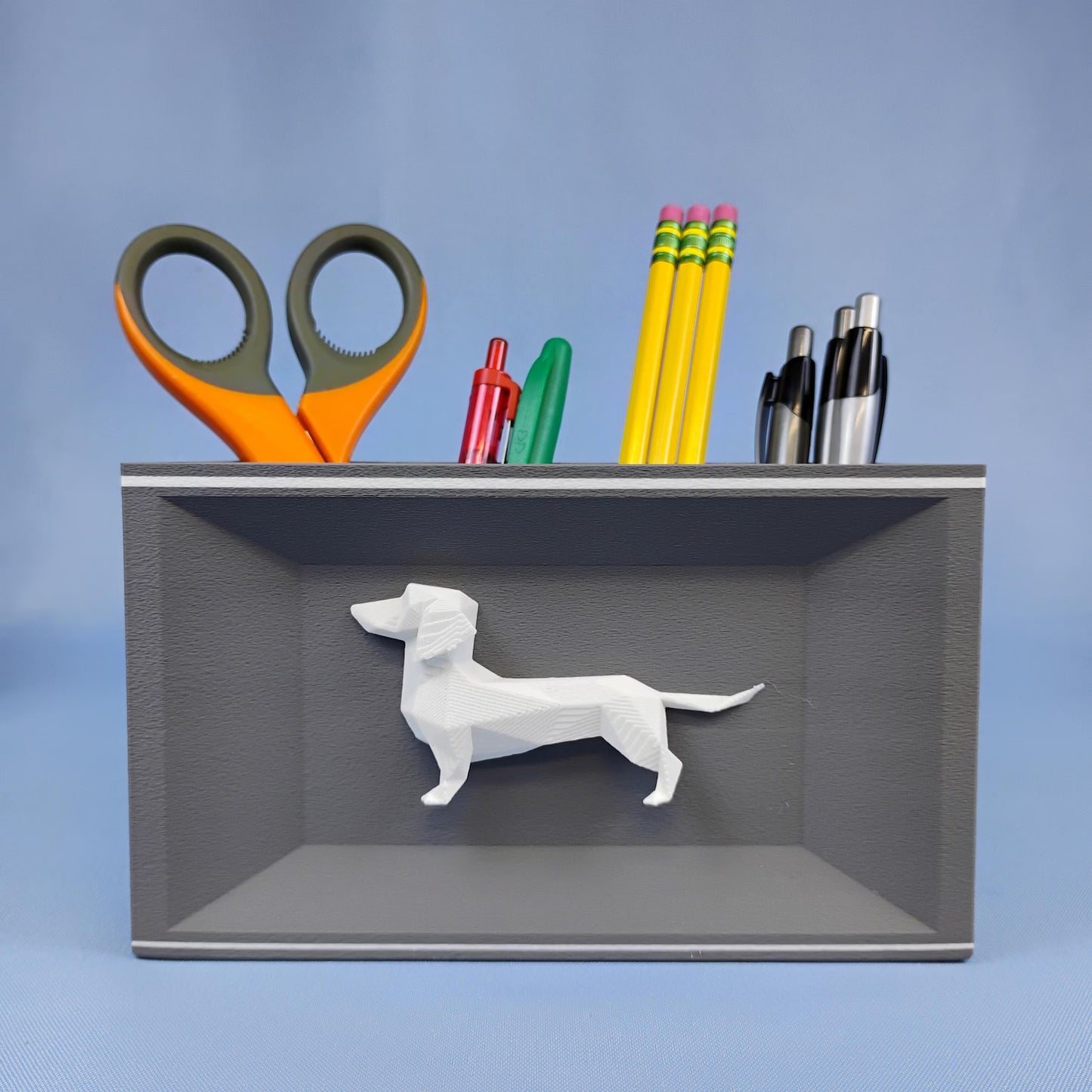 Gray Dachshund desk organizer holding scissors, pencils, pens, and small office supplies