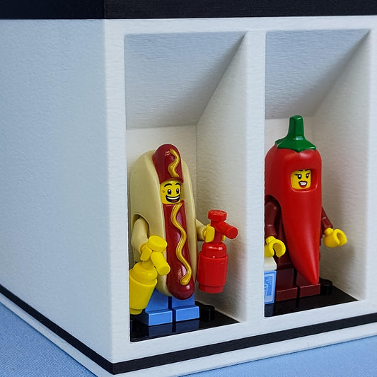 Two LEGO figures of a hot dog and a chili pepper in a display desk organizer display.