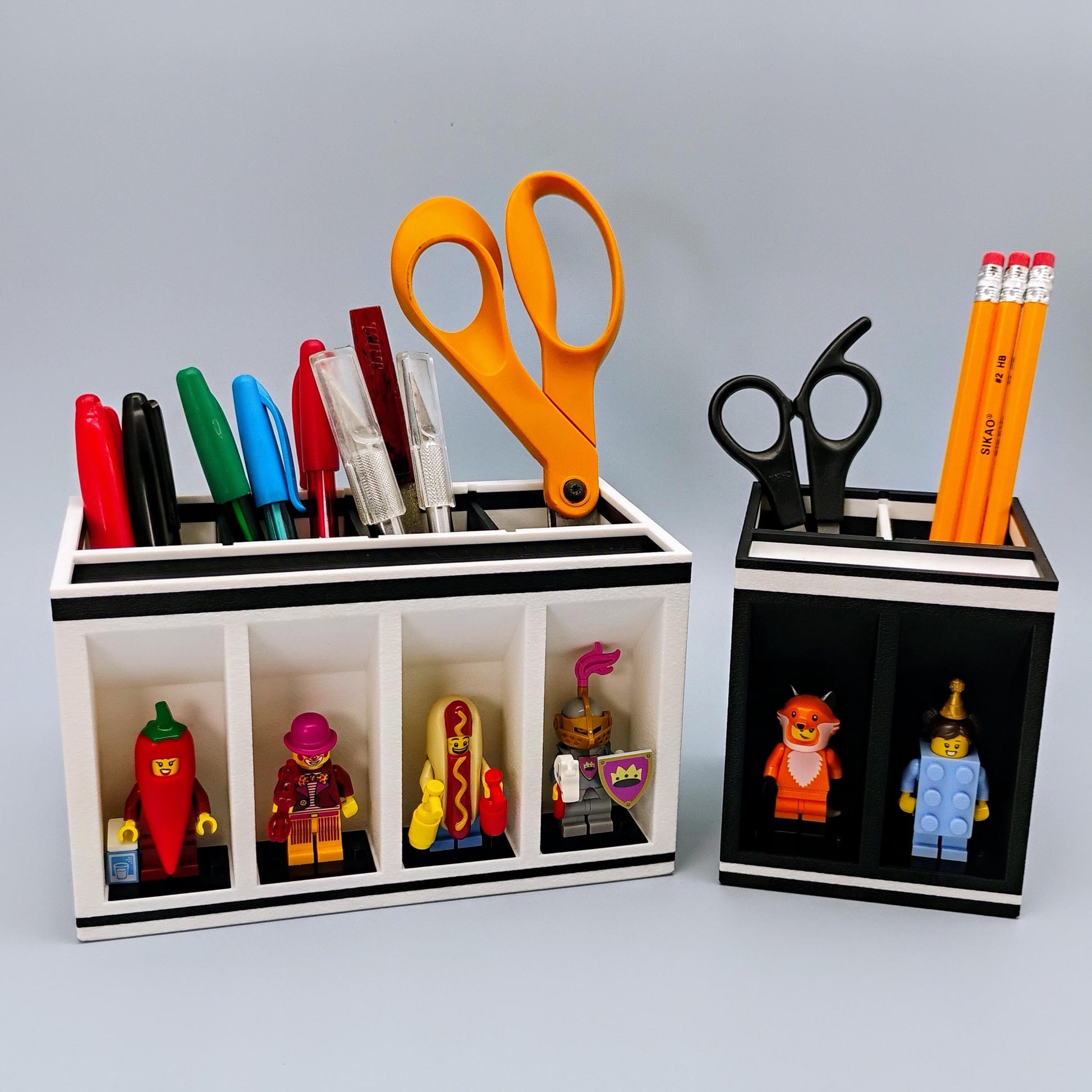 Two desk organizers with stationery items including LEGO minifgures on a blue background