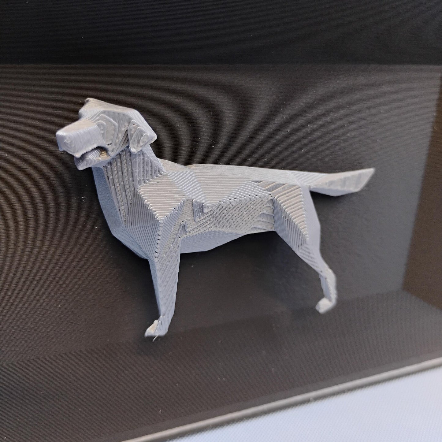 Close-up of raised geometric Labrador detail used on the front of the desk organizer