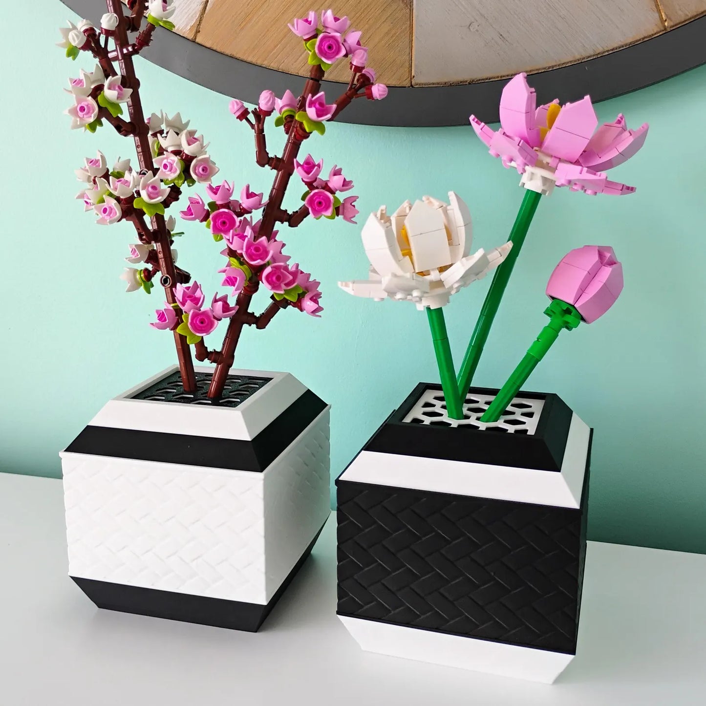 Geometric vase set holding LEGO® botanical flowers with removable stem grid inserts