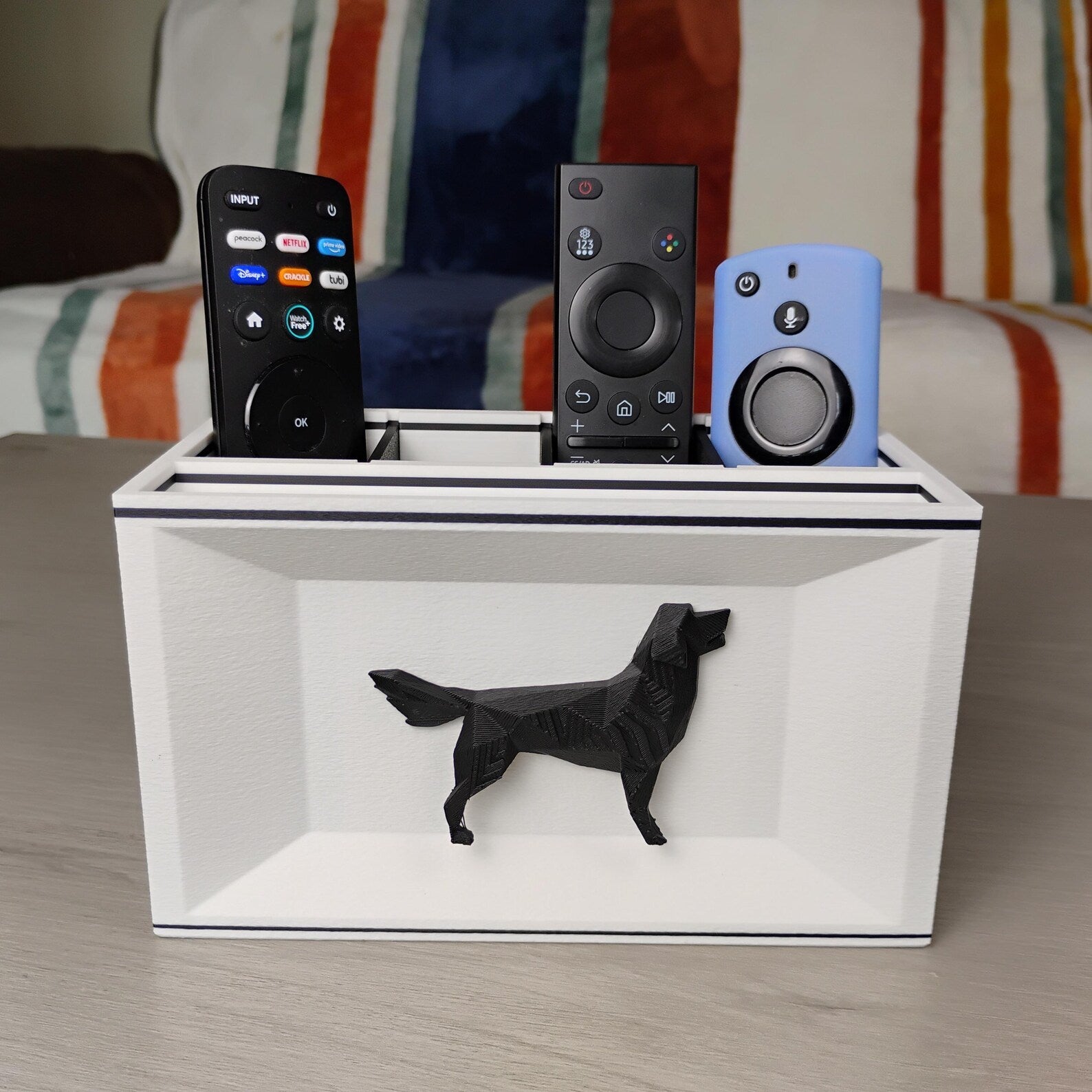 White Golden Retriever desk organizer on a tabletop holding remotes and small electronics
