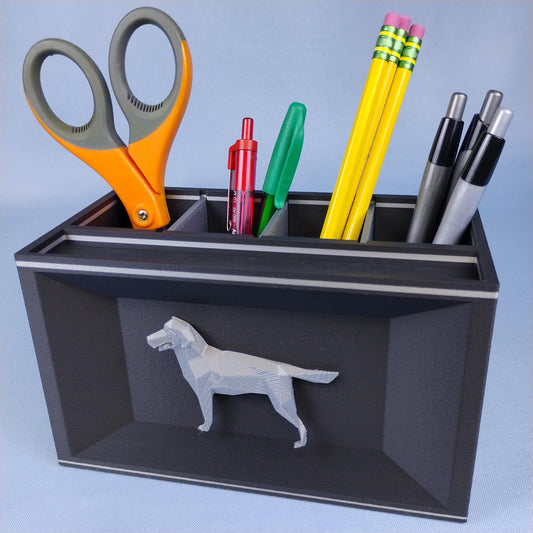Black Labrador desk organizer with removable dividers holding pens, pencils, scissors, and office supplies
