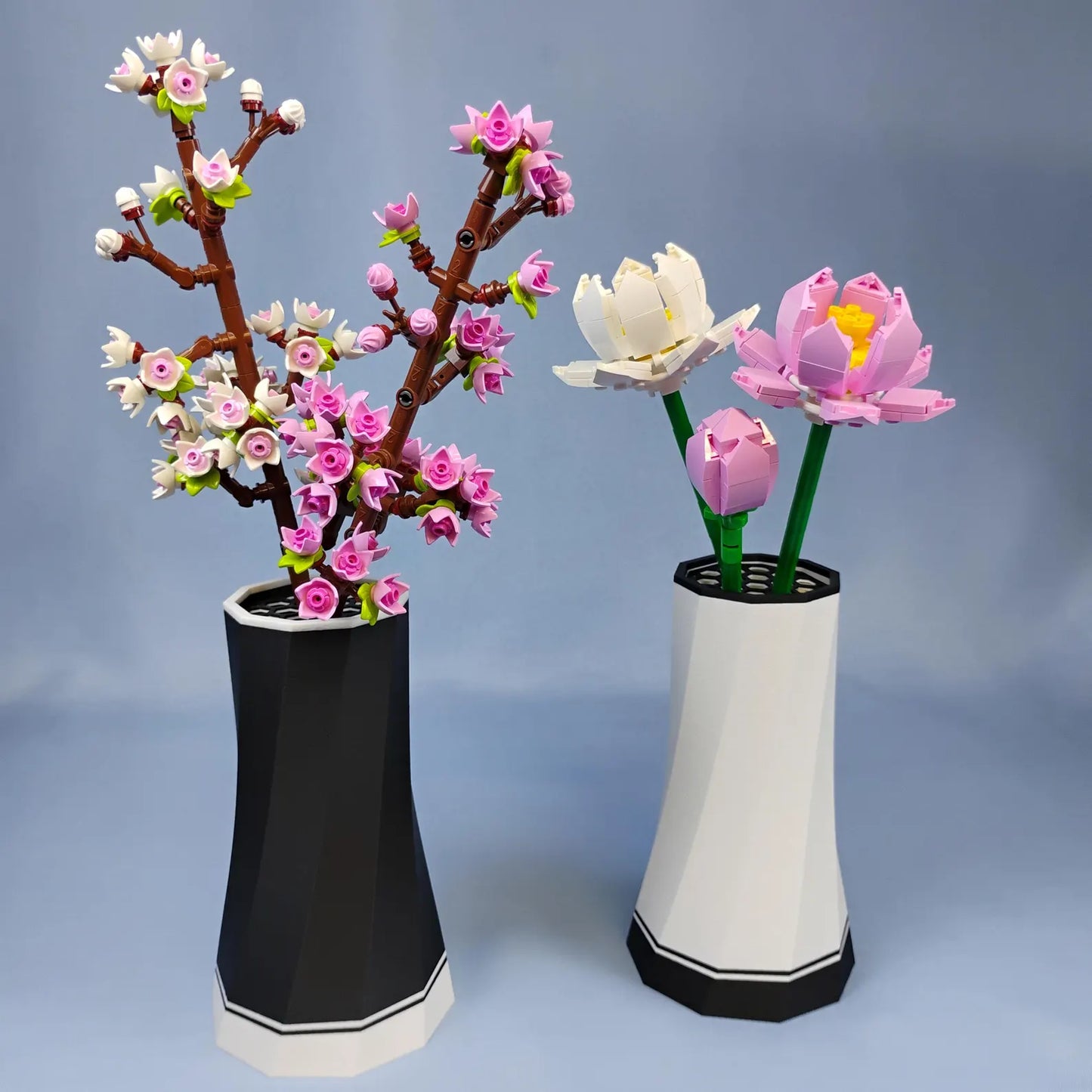 Black and white faceted LEGO® Botanical vases shown with pink and white flower stems, highlighting color options for bouquet displays.