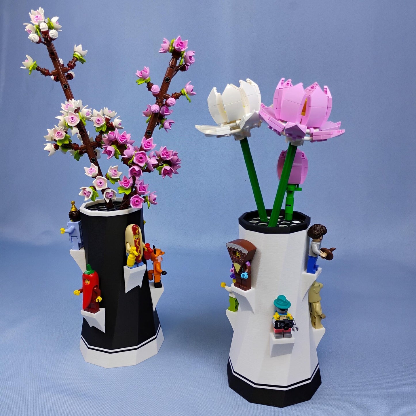 Set of black and white vases holding LEGO® botanical flowers with minifigure display shelves