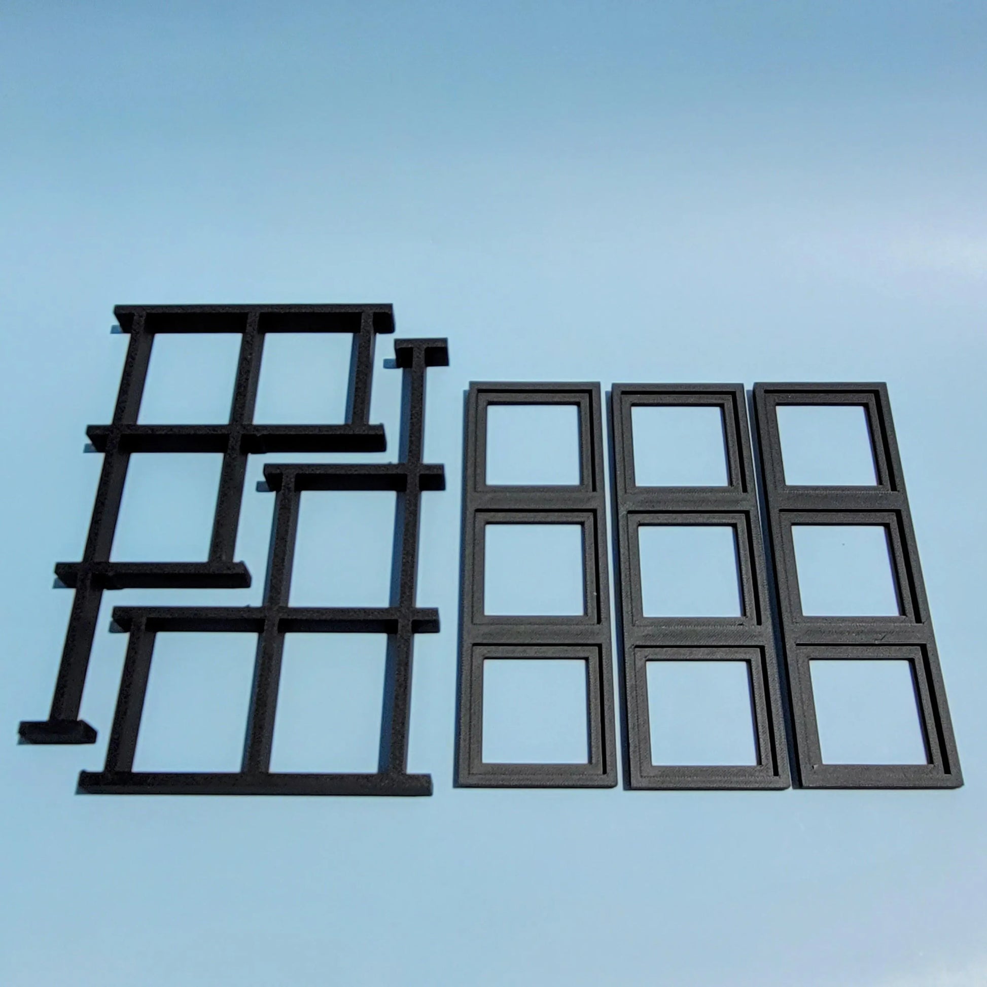 Disassembled display stand for LEGO Brickheadz figures. Blue background
