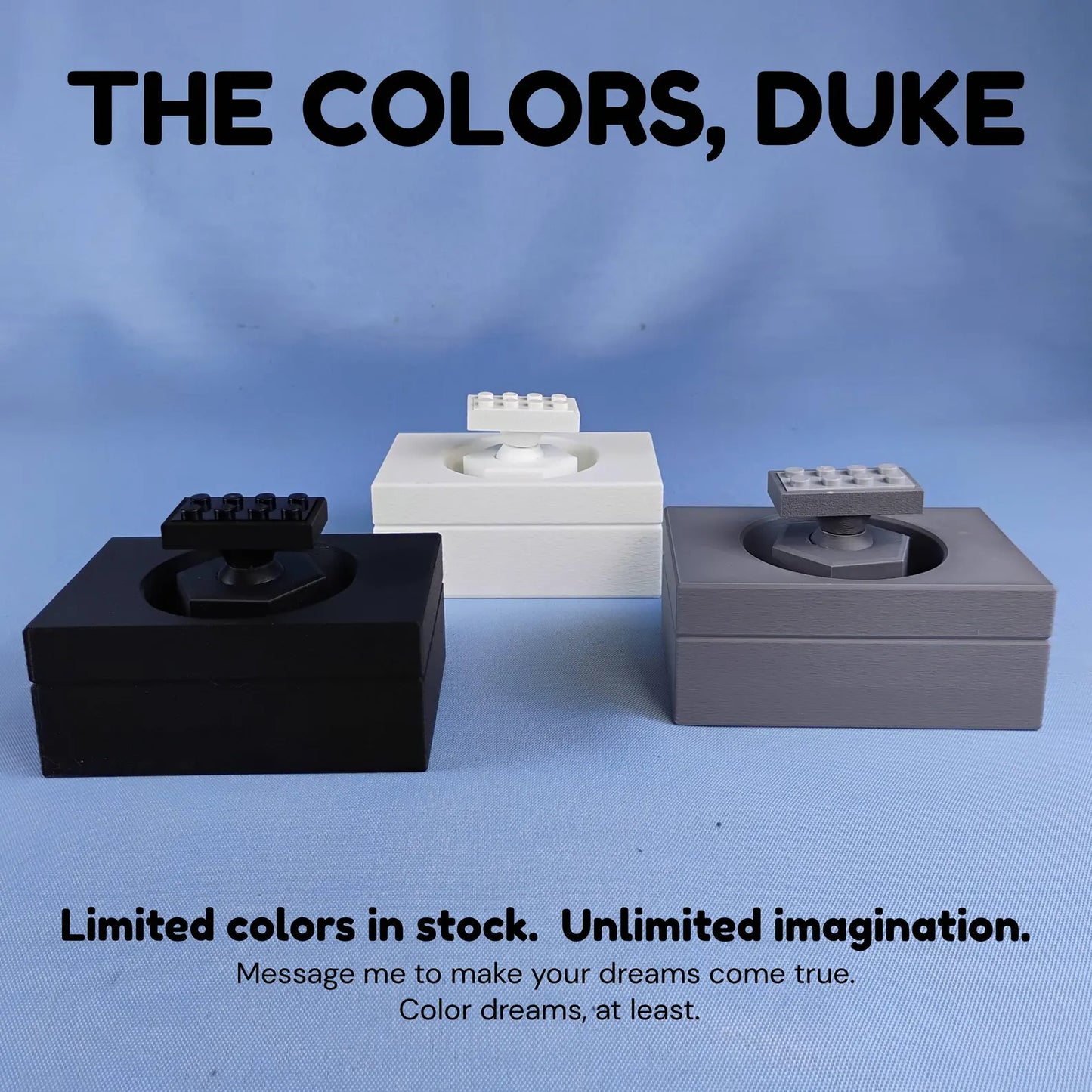 Color options for adjustable desk display stand for LEGO® ships, shown in black, white, and gray.