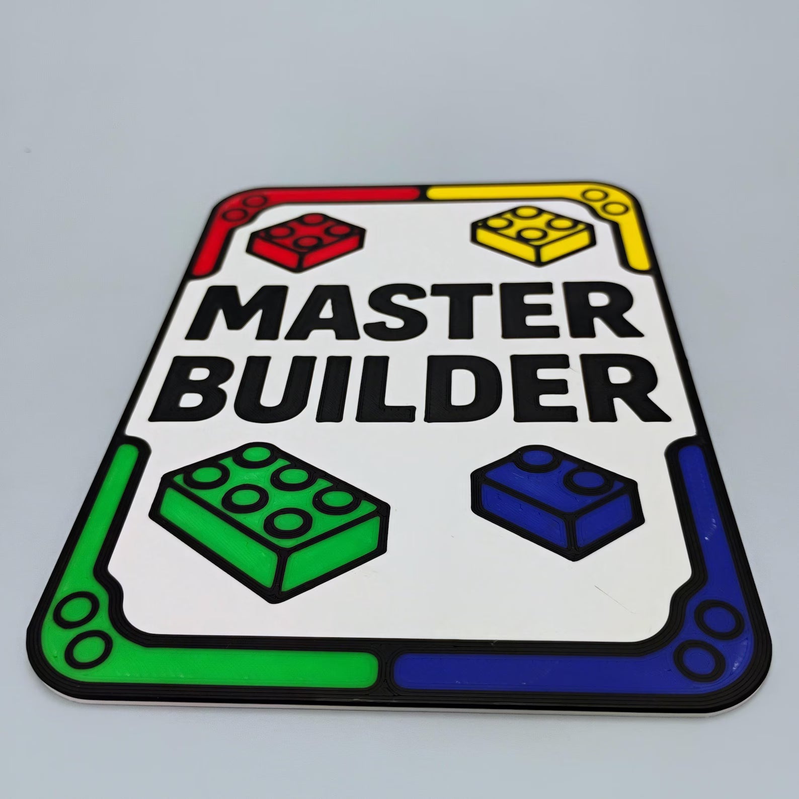 Angled view of a Master Builder 4x6 sign with colorful brick graphics