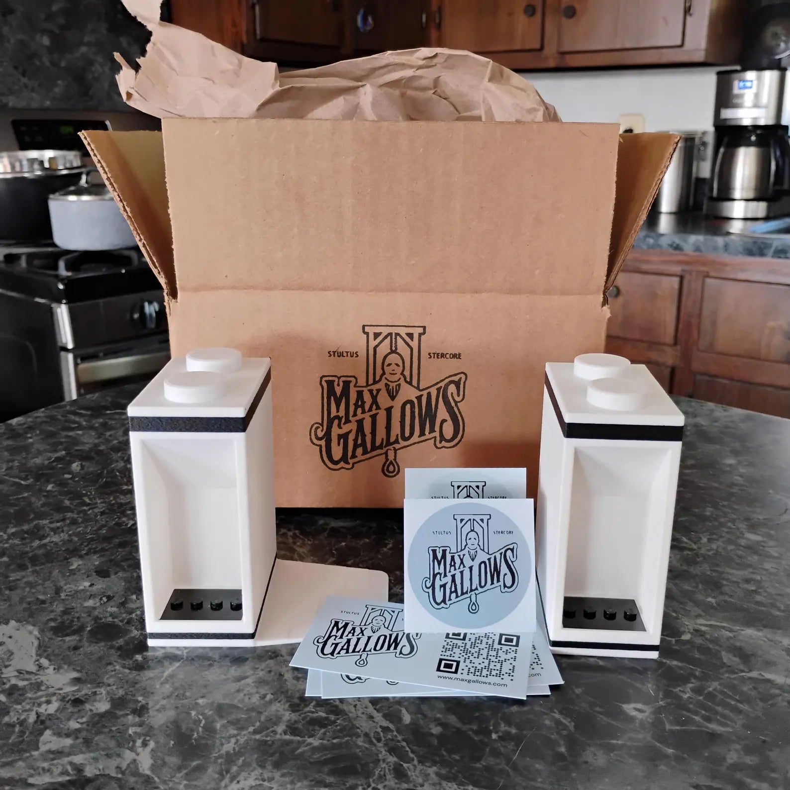 Bookends set shown with Max Gallows packaging, stickers, and included display mounts
