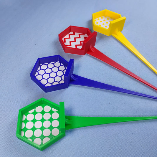 Red, yellow, blue and green LEGO® minifigure garden stakes with four different patterned display backgrounds.