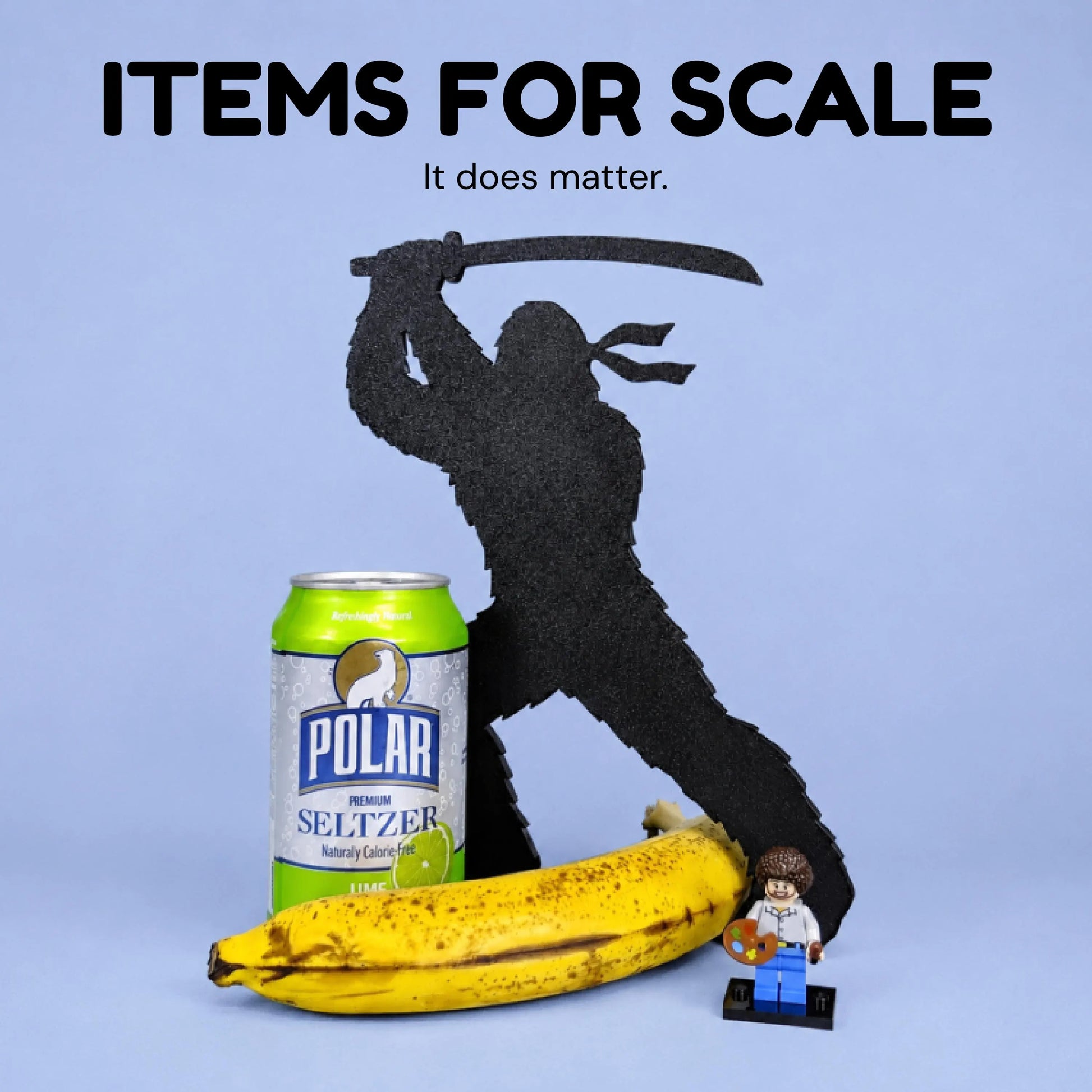 Ninja Bigfoot Garden Spike shown beside a banana, soda can, rubber duck, toy figure, and other objects for scale.