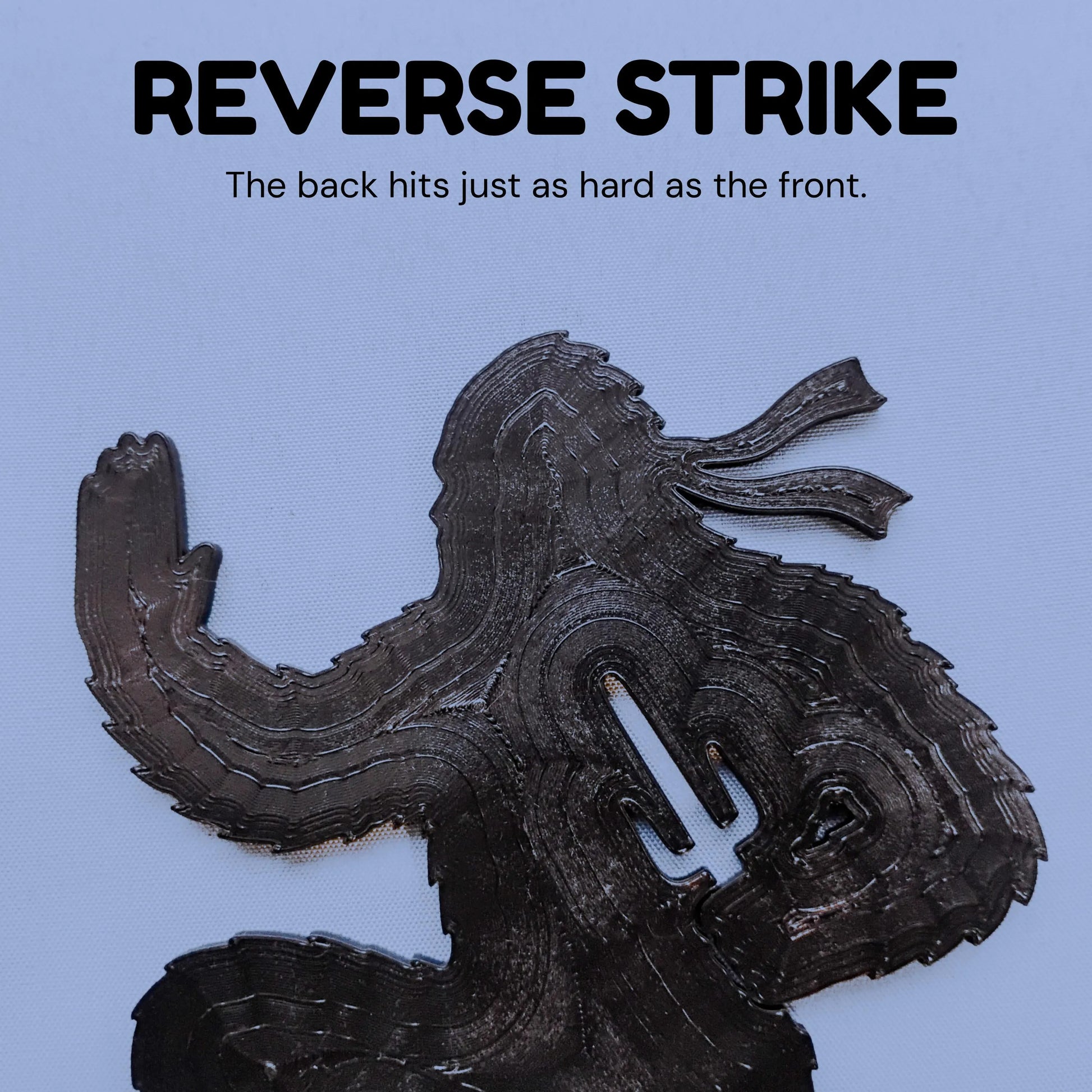 Back of a Ninja Bigfoot figure showing the hidden slots used to attach the removable ground spikes.
