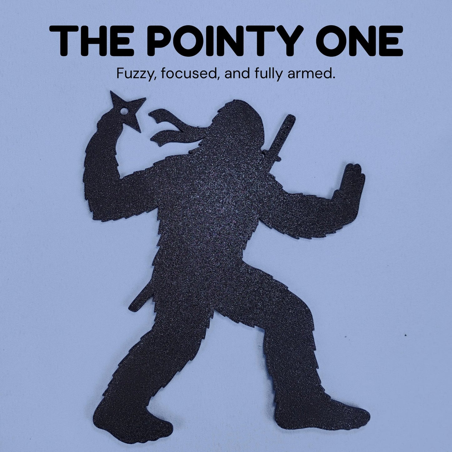 The Pointy One Ninja Bigfoot silhouette holding throwing stars with the caption Fuzzy, focused, and fully armed.