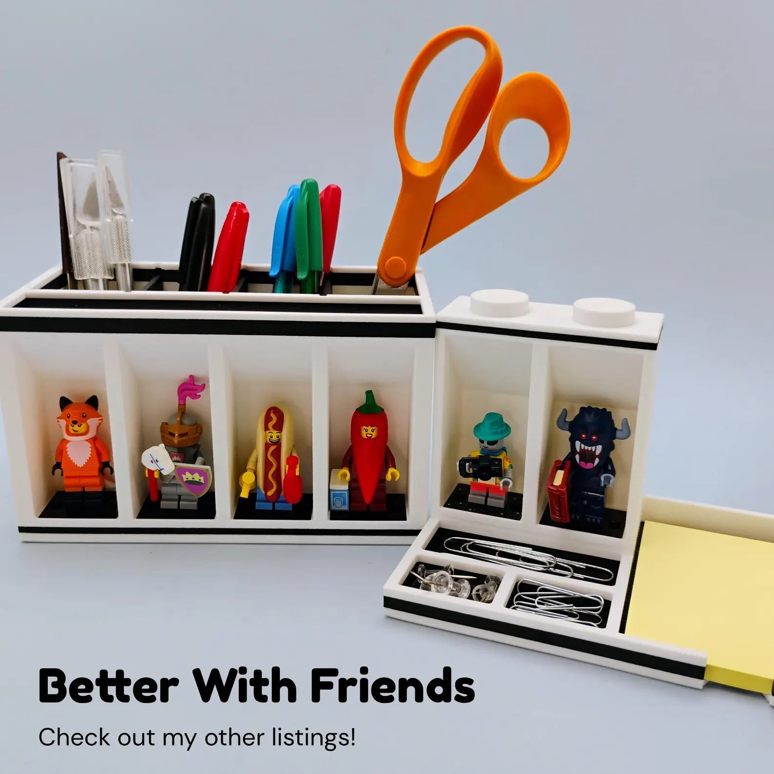 Post-it Note holder paired with desk organizer, pens, scissors, and LEGO® minifigure display spots