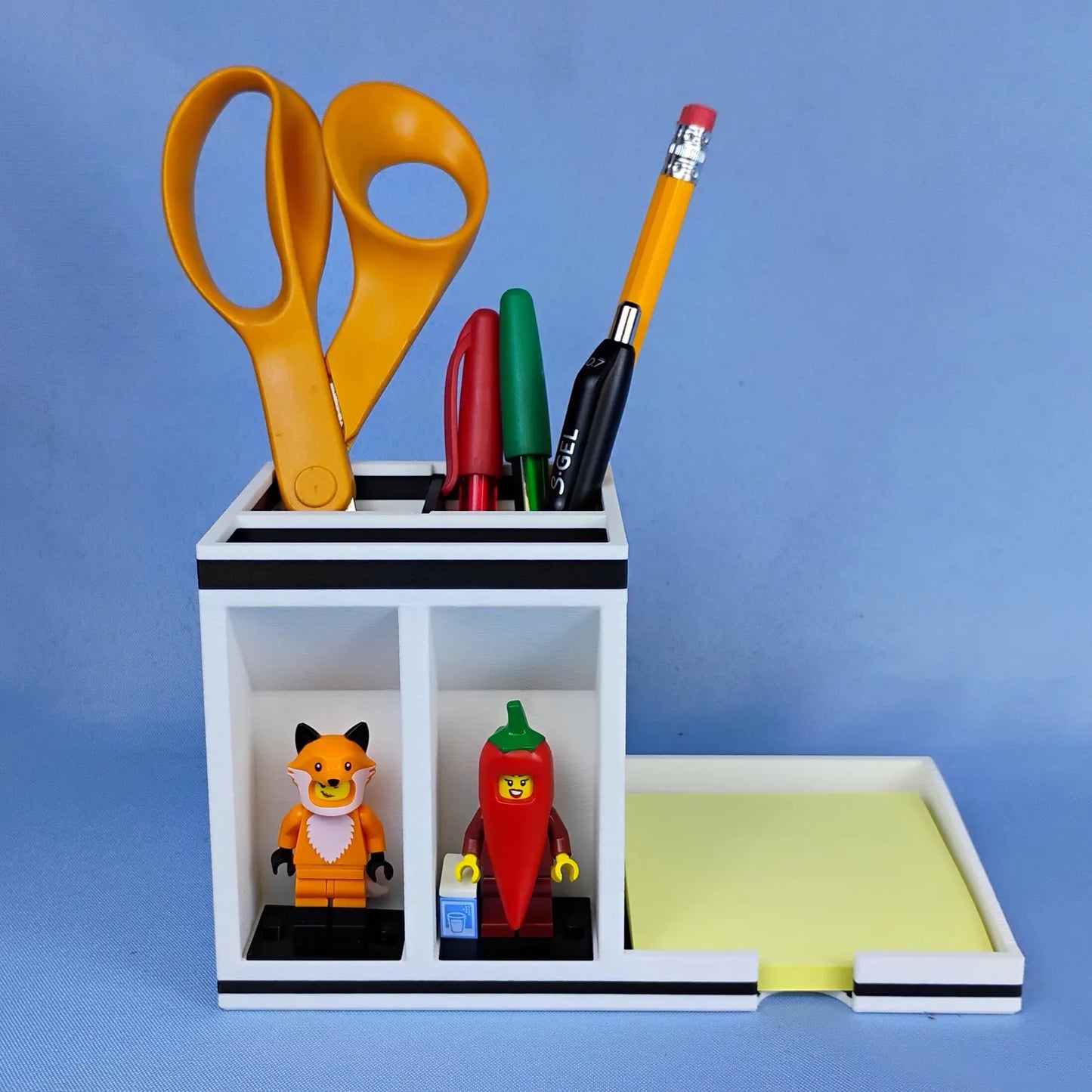 White Post-it Note holder with LEGO® minifigure display spots and upright pen storage
