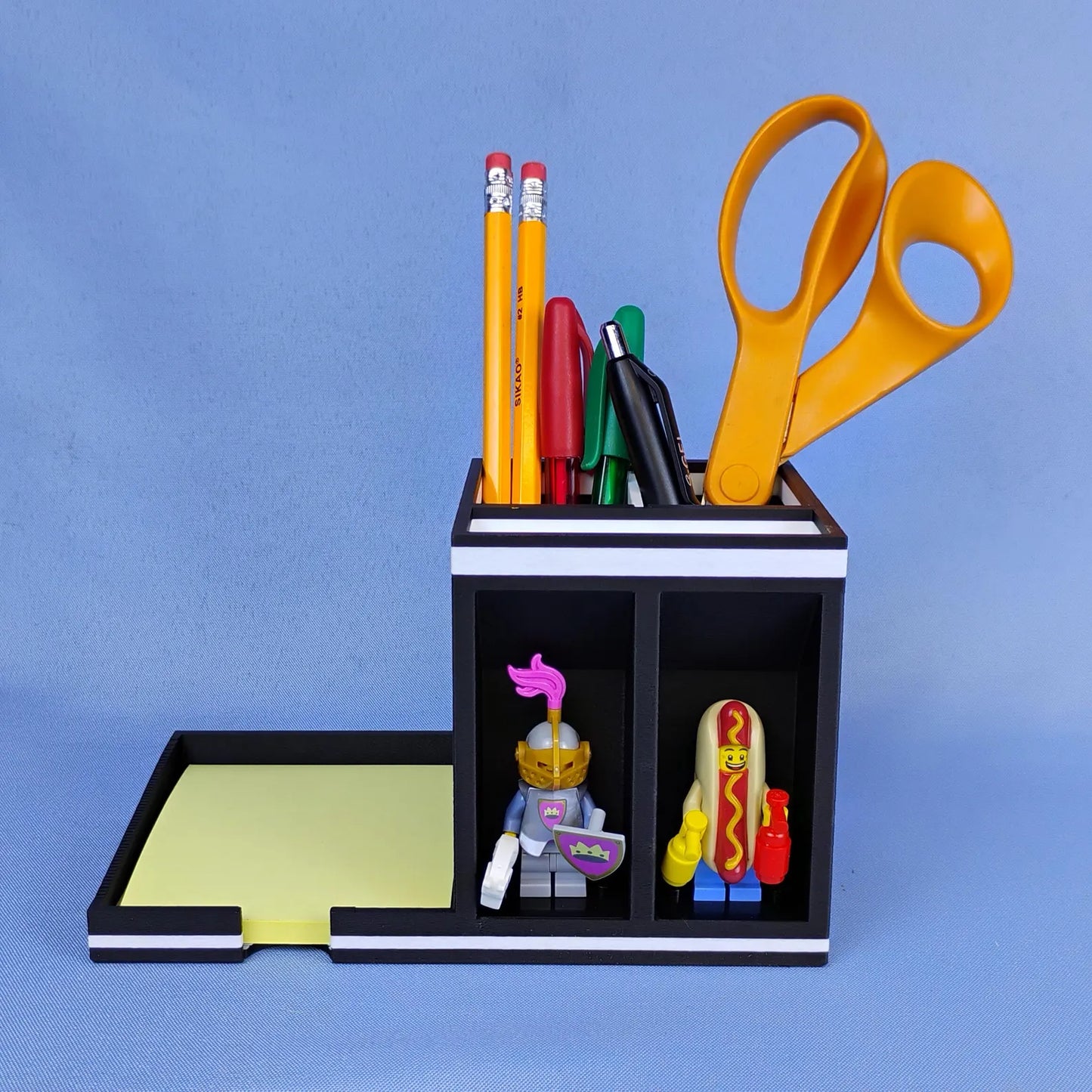 Post-it Note holder with minifigure display spots on the left and pen storage compartment on the right