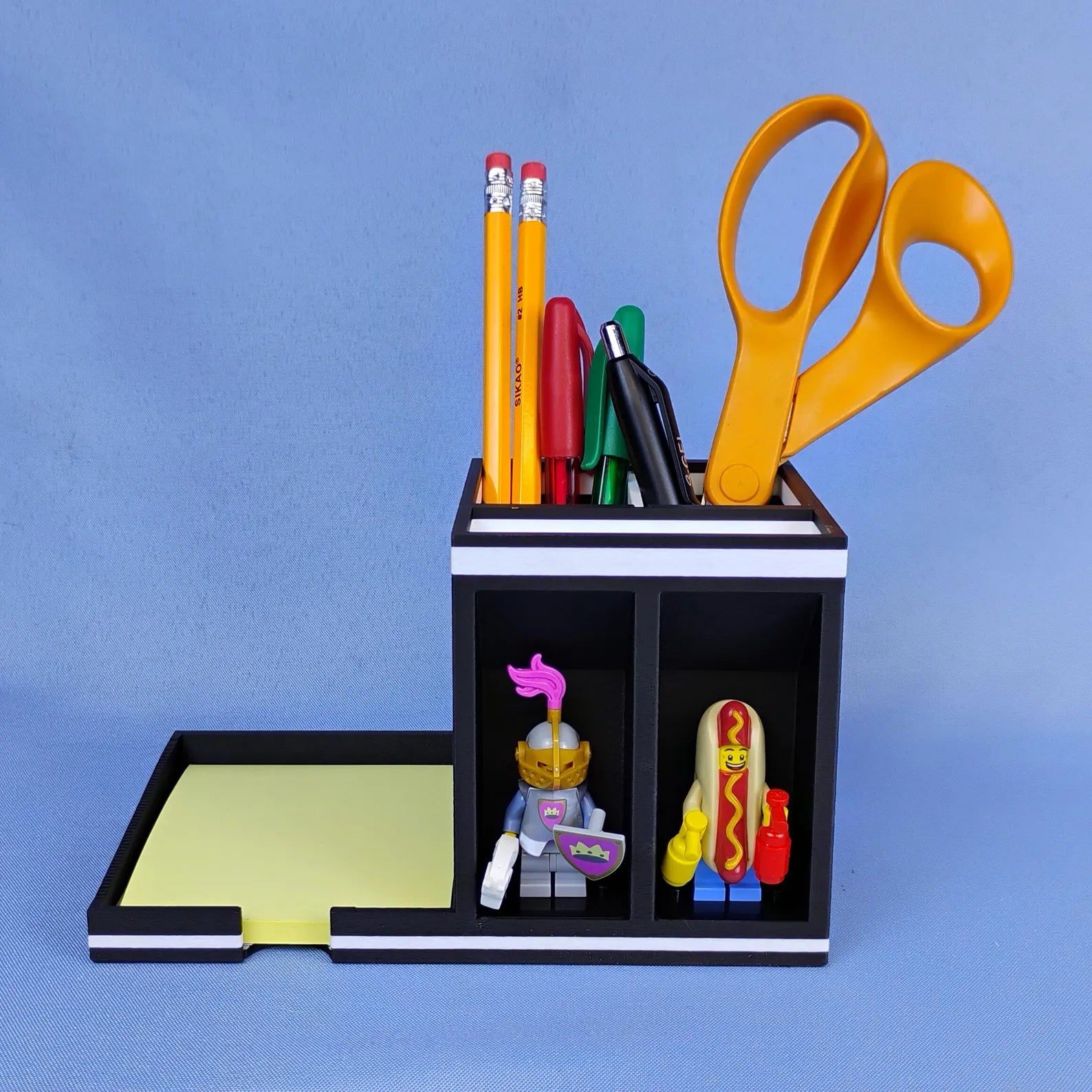 Post-it Note holder with minifigure display spots on the left and pen storage compartment on the right