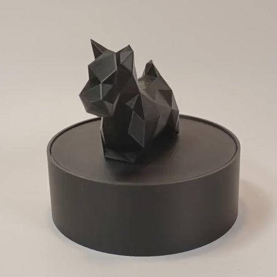 Low-poly Scottish Terrier figurine displayed on a rotating stand for product video