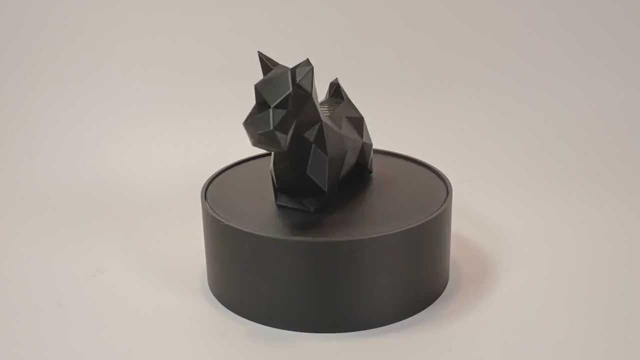 Low-poly Scottish Terrier figurine displayed on a rotating stand for product video