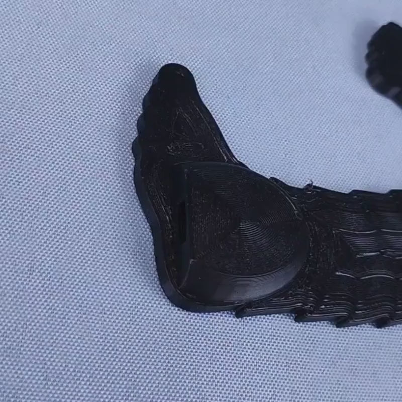 Close-up video showing how the removable ground spike connects beneath a Ninja Bigfoot Garden Spike figure.