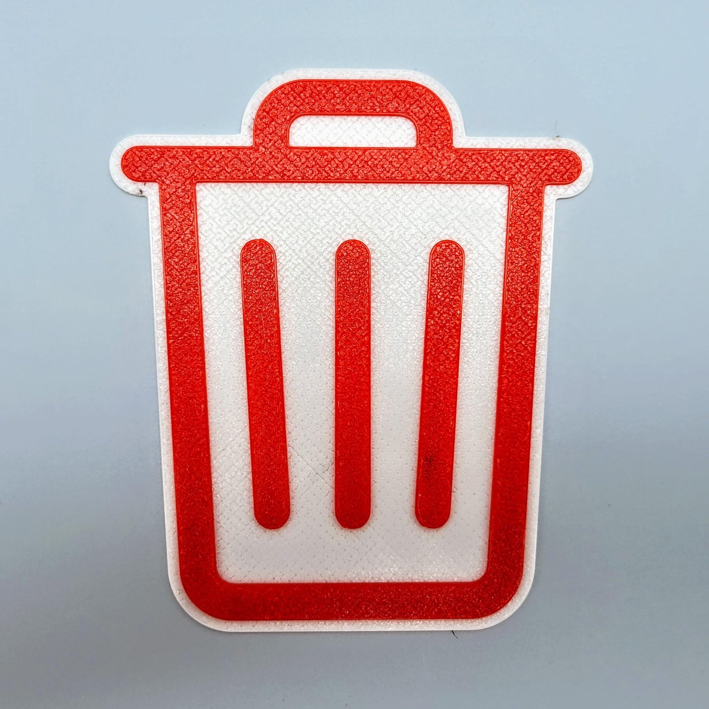 Red trash bin sign with bold white trash can icon, designed as a durable outdoor label for garbage cans and curbside bins