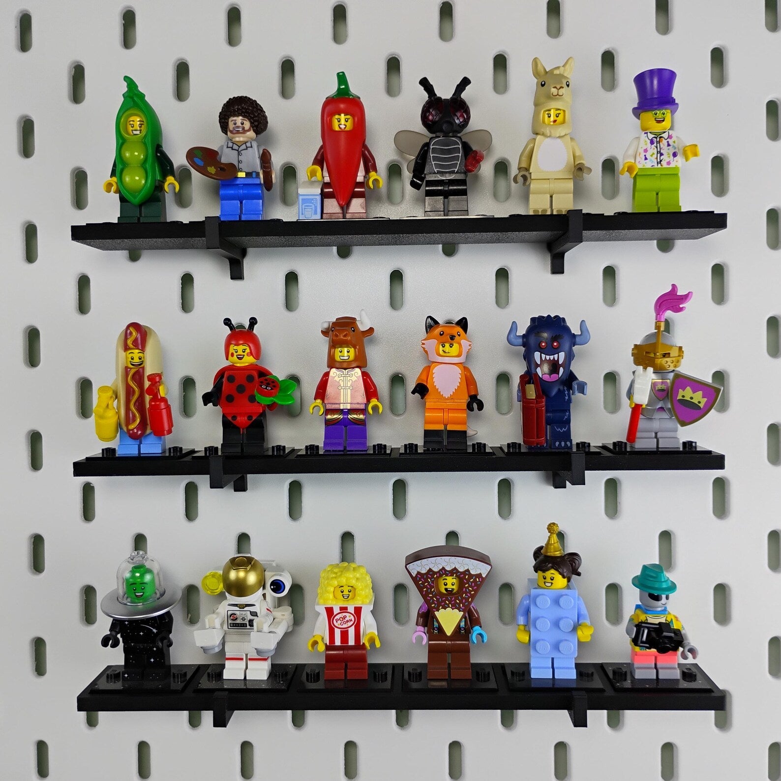 Full LEGO® minifigure collection displayed on multiple black SKADIS compatible shelves