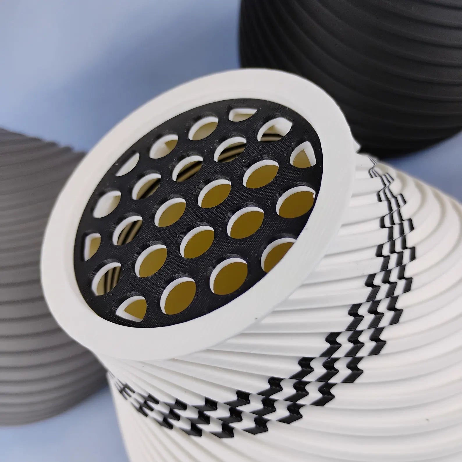 Close-up of swirly vase with removable grid insert for holding LEGO® botanical flower stems