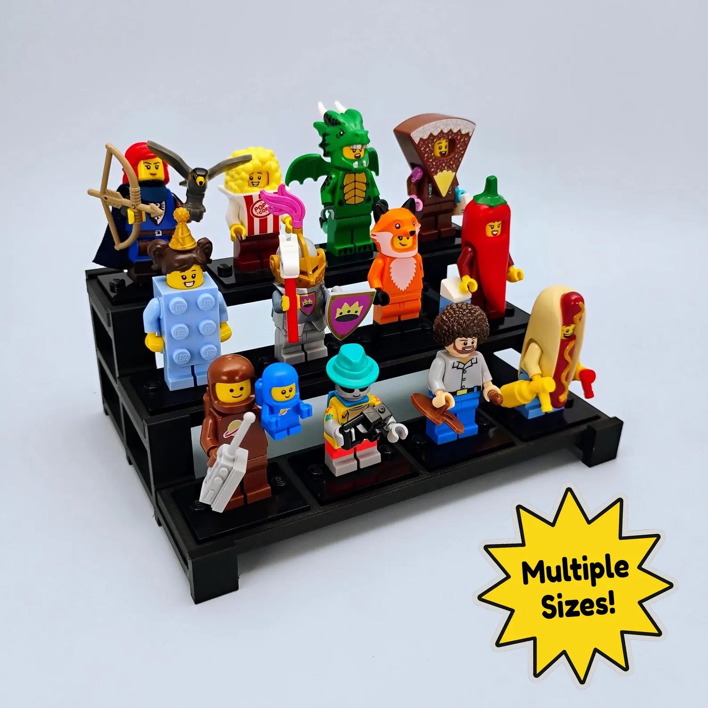 Tiered display stand for LEGO® minifigures shown with a colorful collection of figures and a multiple sizes badge.