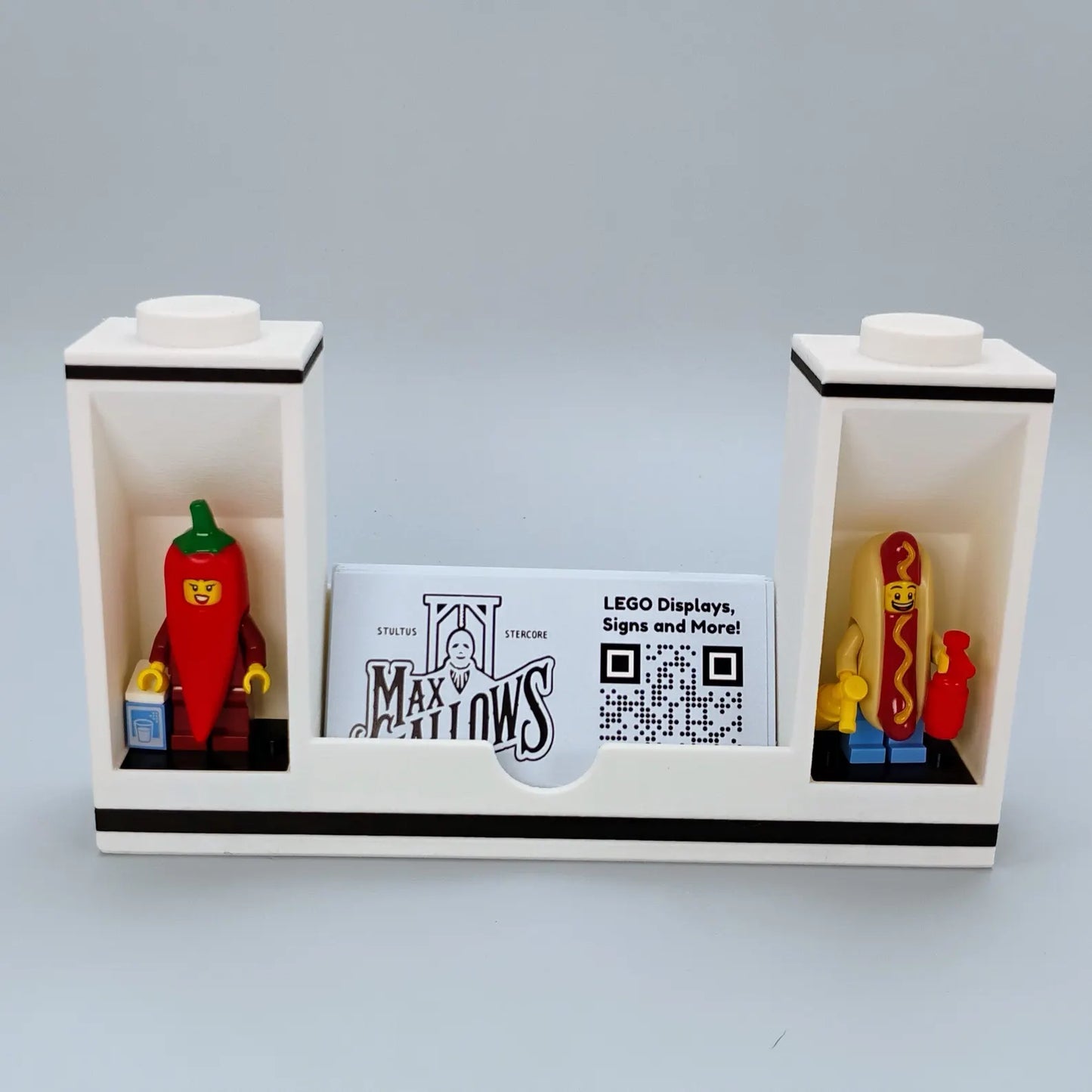 White business card holder with LEGO® minifigure display spots on each side of the card slot