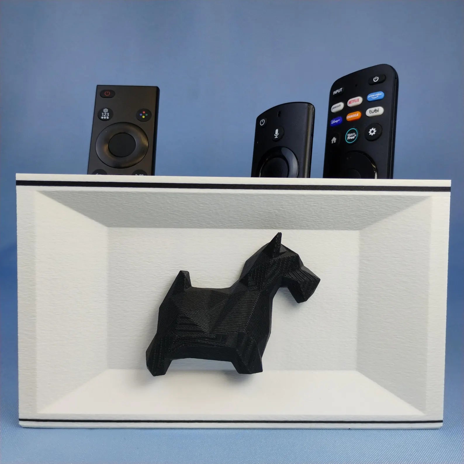 White Scottish Terrier remote holder with black dog detail and removable divider compartments