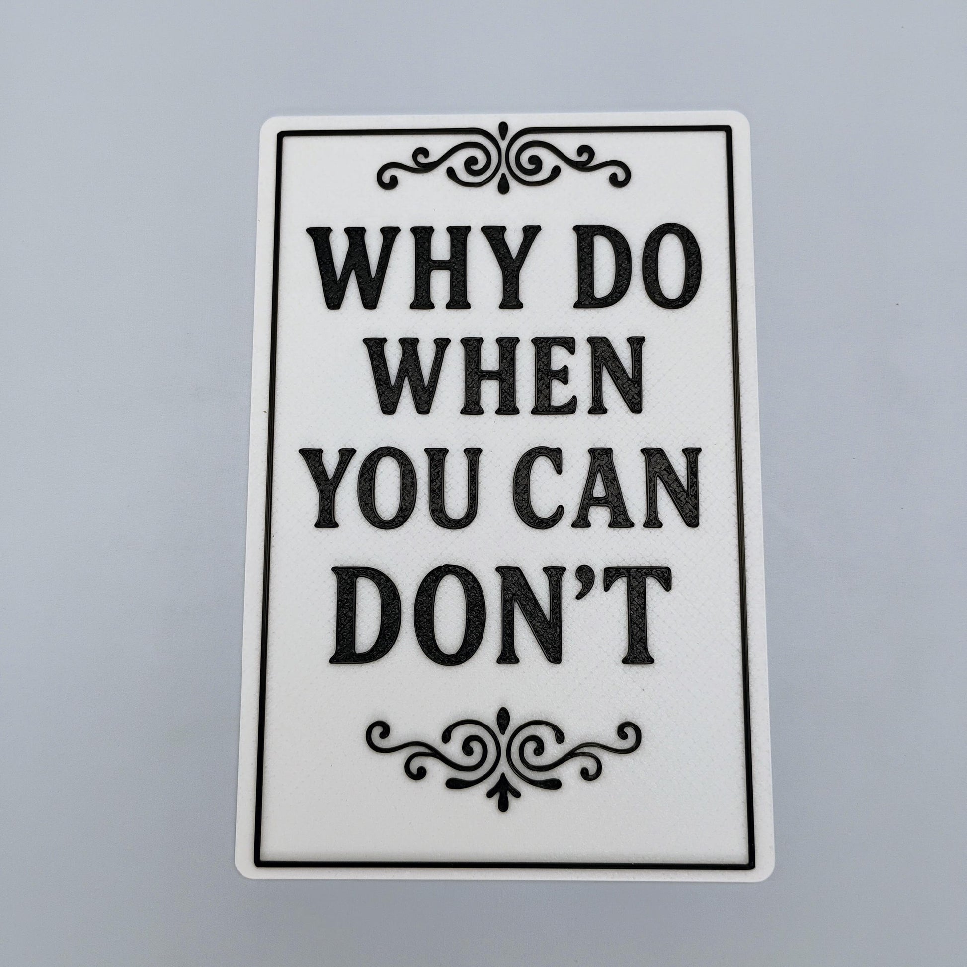 Why Do When You Can Don't 4x6 funny sign with black raised lettering and decorative border